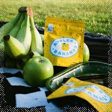 Close-up of Cookies Apples N Bananas dense buds showing frosty trichomes and orange hairs
